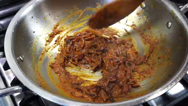Golden-fried potatoes returned to the pan with the aromatic Bengali curry base