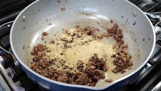 Freshly grated ginger and garlic frying gently in oil until fragrant