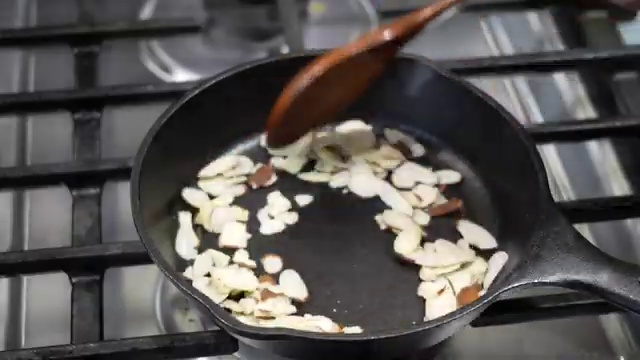 Freshly ground cardamom powder added to warm cooked carrot halwa