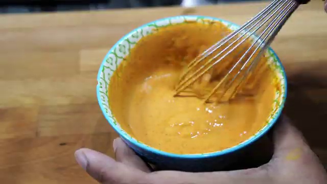 Stovetop heat lowered to gentle flame before pouring in the yogurt spice mixture