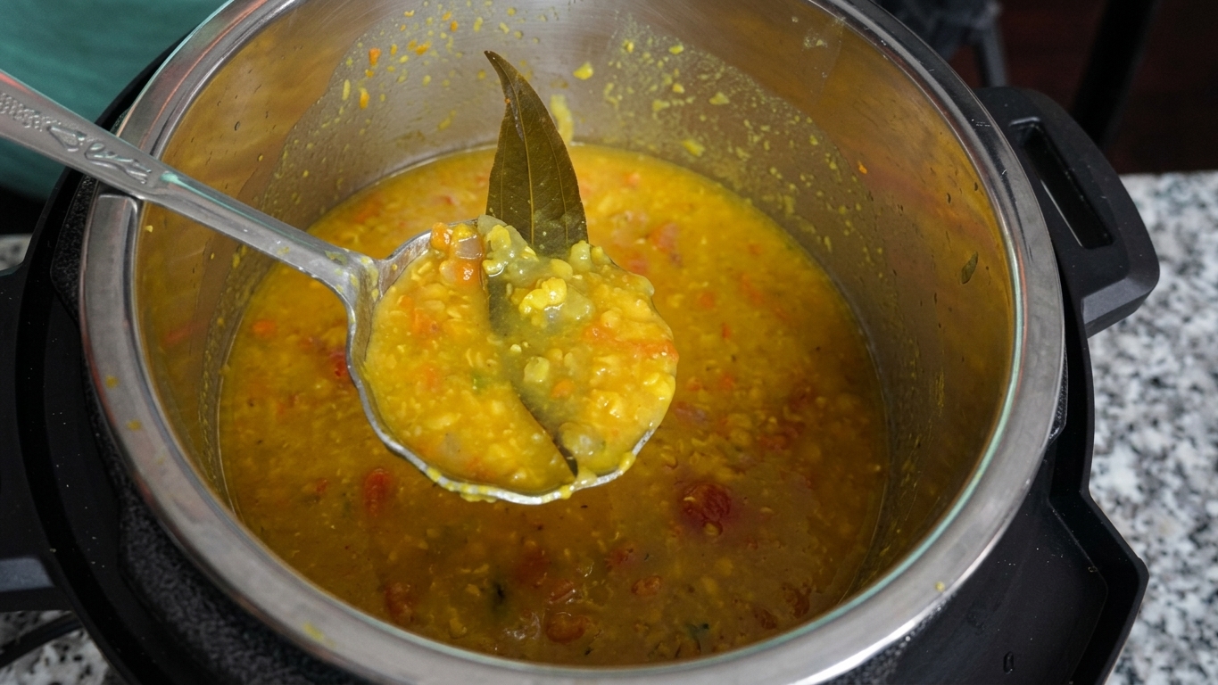 Cooking oil heated in a wide skillet for stir-frying the cubed pumpkin
