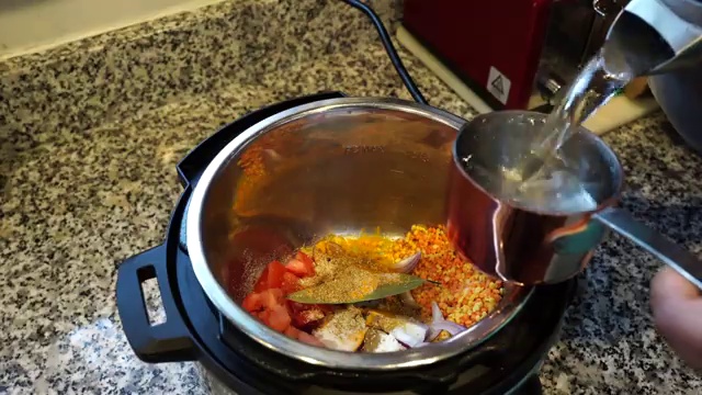 Cooking oil heating in a small tempering pan for the aromatic dal tadka