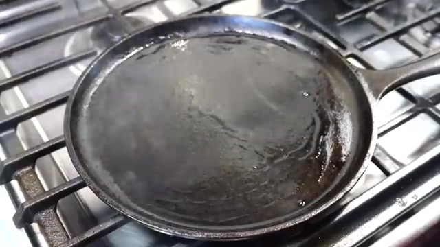 Hot non-stick pan prepared for cooking a besan chilla
