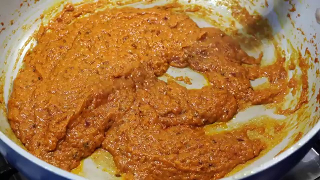 Hot water poured into the thick masala gravy to adjust to a silky consistency