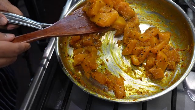 Heat increased to high to evaporate moisture and caramelize the edges of stir-fried pumpkin