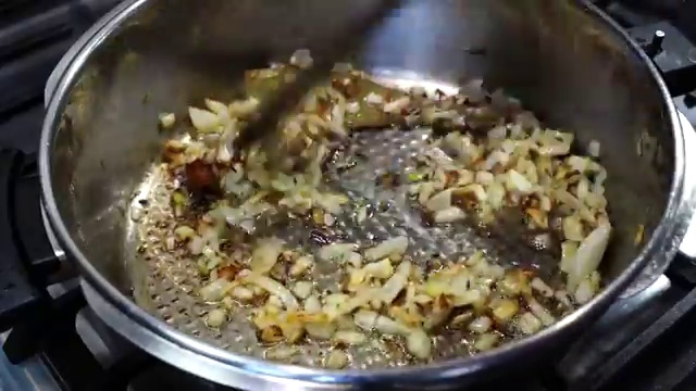 Kashmiri chili powder, turmeric, coriander, and cumin powders added to the curry base