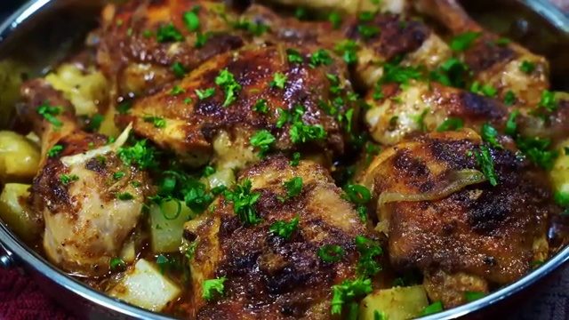 Leftover baked buttermilk chicken and roasted potatoes stored in an airtight glass meal-prep container