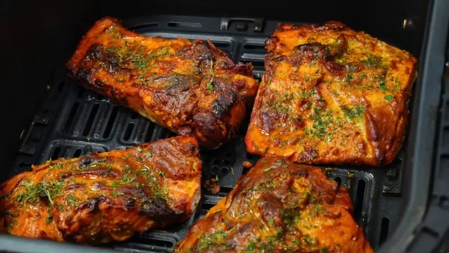 Leftover cooked tandoori fish stored safely in an airtight container for refrigeration