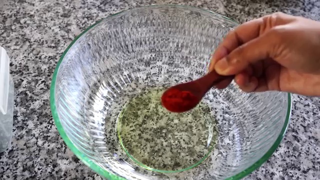 Marinated chicken pieces showing liquid released from the first lemon-salt marination