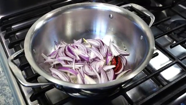 Masoor dal thoroughly stirred and combined with the fragrant panch phoron and onion tadka