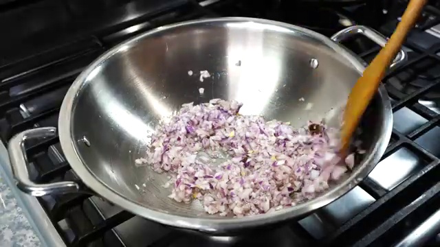 Cooking oil and rich golden ghee heating together in a heavy-bottomed pan