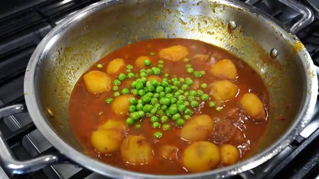 A cooked baby potato gently crushed with a spoon to naturally thicken the gravy