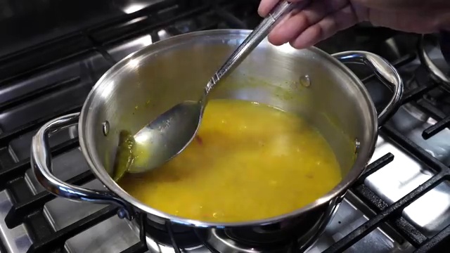 Panch phoron (Bengali five-spice seeds) spluttering and sizzling in hot oil