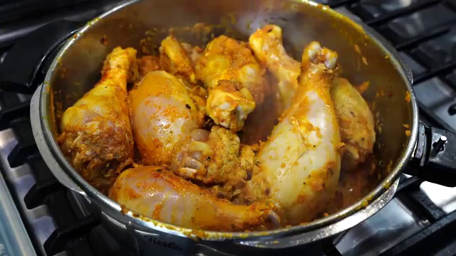 Chunky cut potatoes, carrots, and green papaya pieces added into the spiced chicken mixture