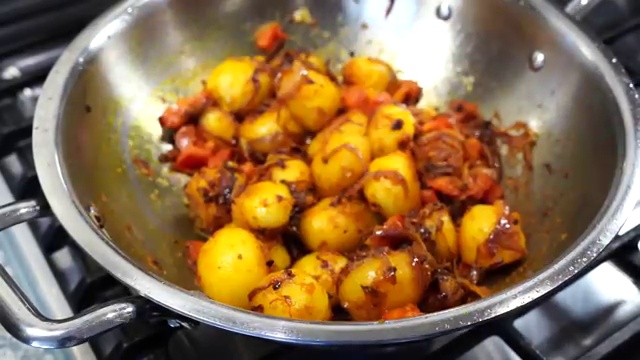 Baby potatoes coated in a thick, fragrant tomato and spice masala