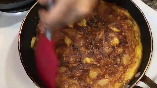 Potatoes, onion, eggs, green chili, red chili, cumin powder, turmeric, red chili powder, oil, and fresh coriander arranged for Spanish omelette