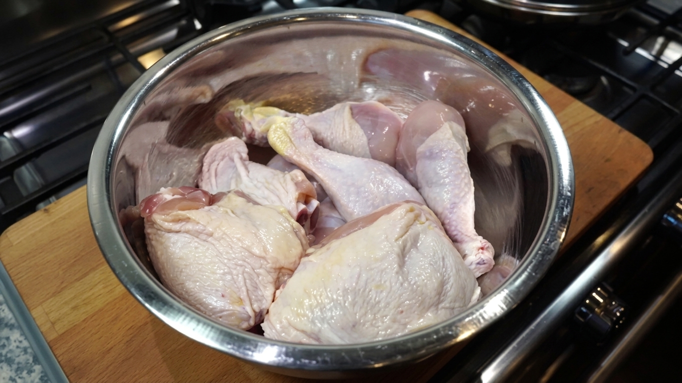Creamy buttermilk poured generously over salted chicken thighs and drumsticks