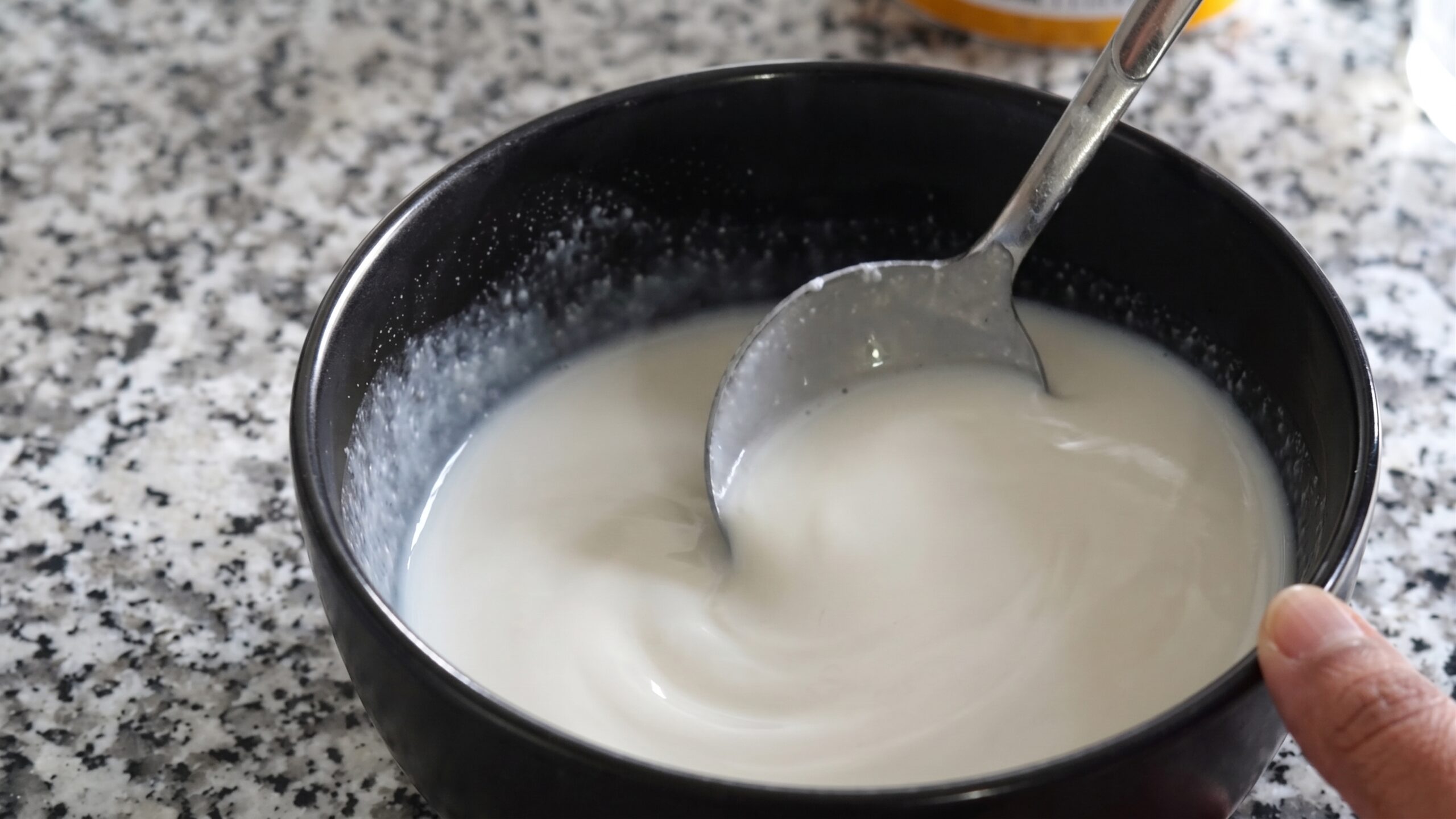 Ready-made dosa batter mixed in a bowl with a thin pourable consistency