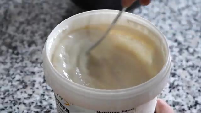 Ready-made refrigerated dosa batter being stirred in a container