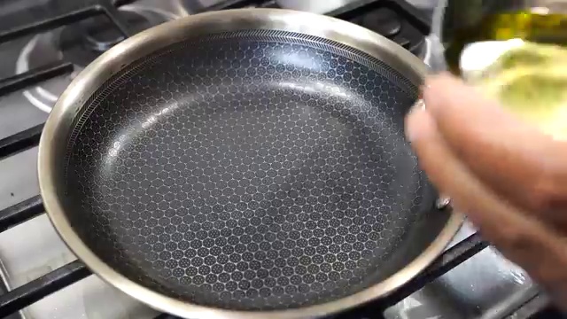 Crisp, golden-brown cooked chickpea chilla transferred from the pan to a serving plate