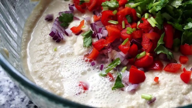 Blended smooth chickpea chilla batter resting in a bowl for 10 minutes to hydrate