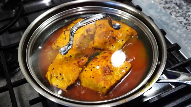 Whole black mustard seeds and Bengali panch phoron five-spice dry-roasting in a small skillet