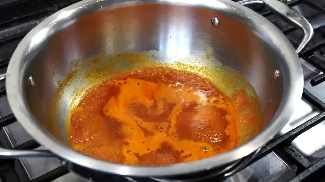 Tender roasted chicken pieces gently added into the smooth simmering butter chicken gravy