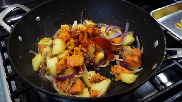 Fresh fish fillets seasoned evenly with sea salt and turmeric powder in a bowl