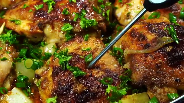 Baked buttermilk chicken served on a platter with tender caramelized potatoes and onions