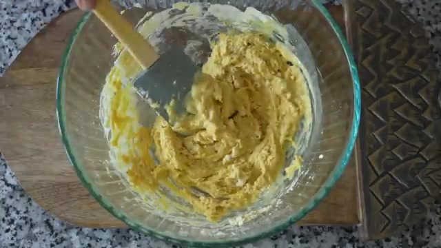 Smooth pouring-consistency besan chilla batter being whisked in a bowl