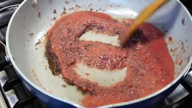 Smooth fresh tomato puree poured into the caramelized onion, ginger, and garlic base
