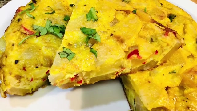 Spanish potato omelette sliced into wedges and served at room temperature for a lunchbox meal