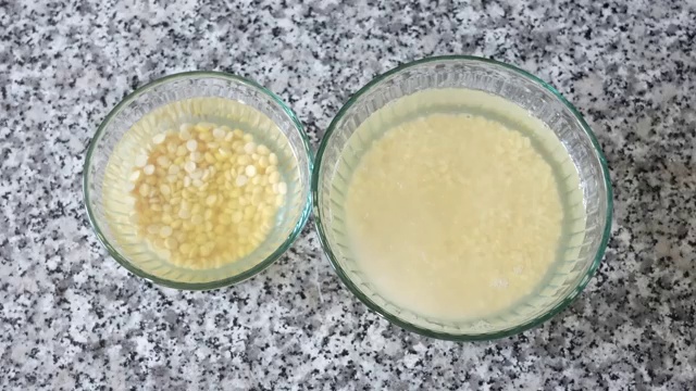 Yellow split moong dal and Bengal gram chana dal soaking in water in separate glass bowls