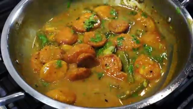 Freshly chopped coriander leaves sprinkled over the finished hot dal bora curry
