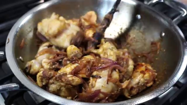 Chicken and yogurt sauce stirred continuously over medium heat until gently bubbling