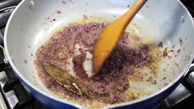 A pinch of sugar added to the onion masala base to promote deep caramelization