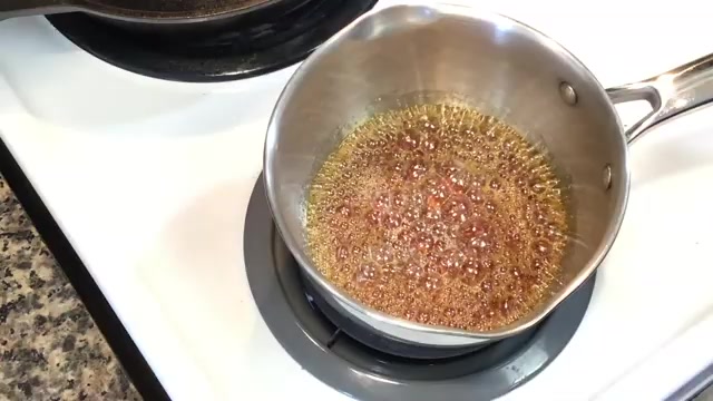 Sugar caramelizing in a light-colored saucepan until golden amber