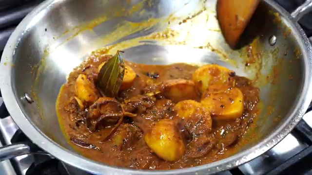 Sweet paprika, Kashmiri chili powder, turmeric, cumin, and black pepper arranged in a bowl