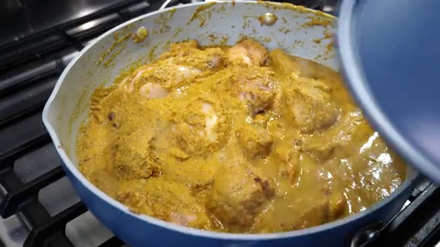 Sweet paprika added to the simmering Xacuti curry for rich color and flavor balance