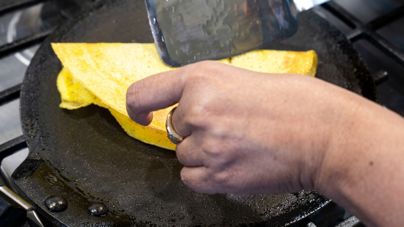 Thick and soft moong dal chilla pancake cooked with a pillowy, tender center