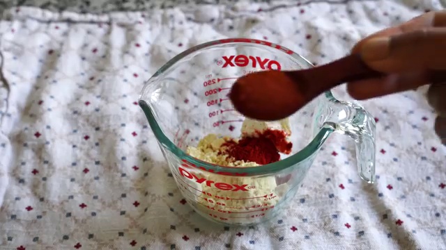 Cooked tomato masala reduction simmering until the fragrant spiced oil separates