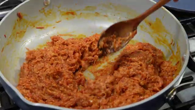 Golden toasted flaked almonds sprinkled generously over warm carrot halwa