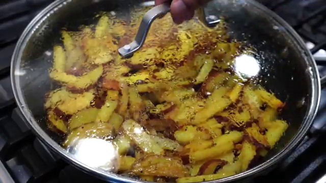 Whole fresh green chilies added to the simmering potatoes for gentle aroma
