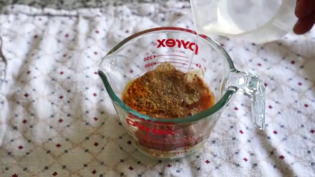 Plain yogurt, gram flour (besan), Kashmiri chili, turmeric, and spices whisked in a bowl
